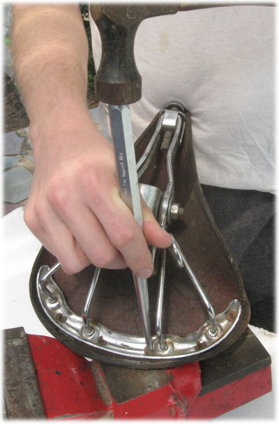 Installing rivets to replace a saddle top or undercarriage