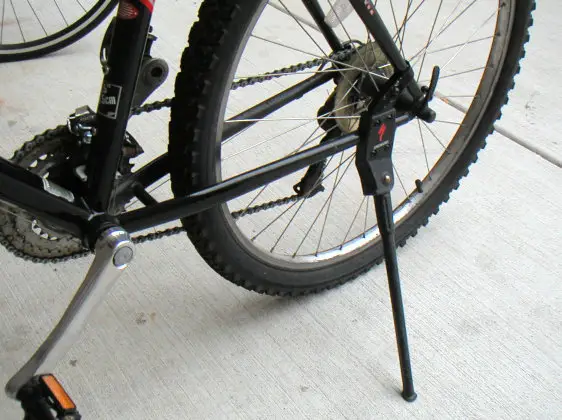 A side stand mounted near the rear hub