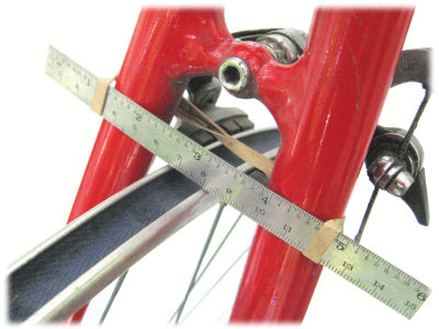 Truing a wheel in the bicycle frame using a ruler